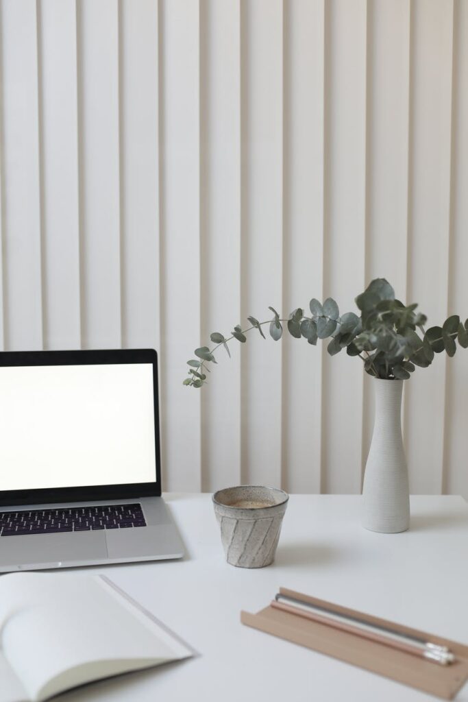 interior of modern workplace with laptop